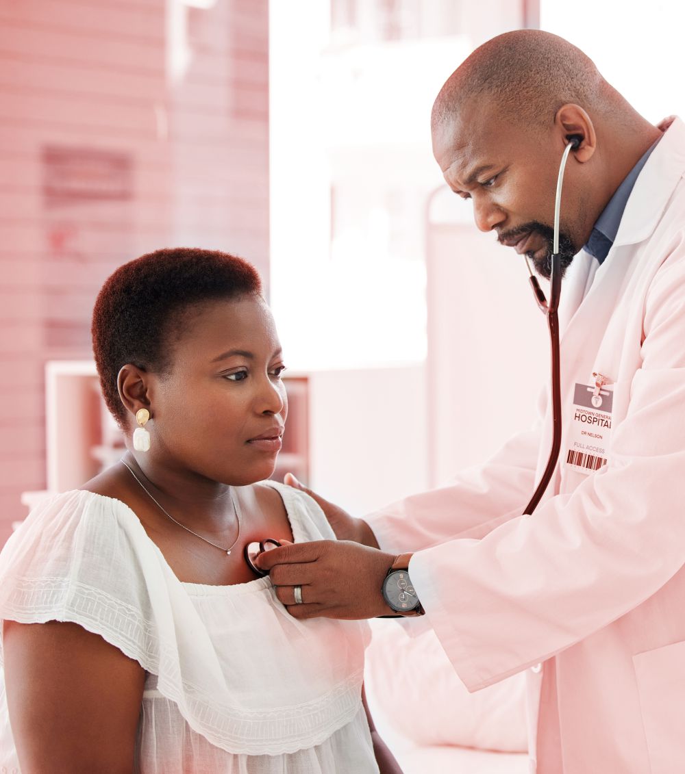 woman with heart disease being examined by doctor